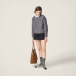 PLEATED PINSTRIPE MINI SKIRT