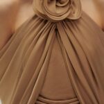 WRAPPED BLOUSE WITH FLOWER APPLIQUÉ