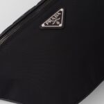 RE NYLON AND SAFFIANO BELT BAG
