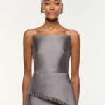TAFETTA PEPLUM GOWN WITH CRYSTAL TRIMMING